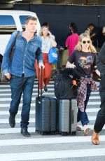 EMMA ROBERTS and Garrett Hedlund at Los Angeles International Airport 07/03/2019