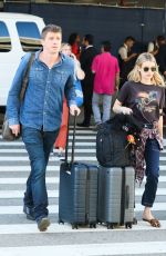 EMMA ROBERTS and Garrett Hedlund at Los Angeles International Airport 07/03/2019