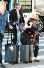EMMA ROBERTS and Garrett Hedlund at Los Angeles International Airport 07/03/2019