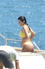 KOURTNEY KARDASHIAN in Yellow Bikini at a Yacht in Corsica 07/26/2019