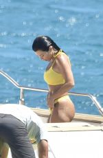 KOURTNEY KARDASHIAN in Yellow Bikini at a Yacht in Corsica 07/26/2019