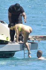 KOURTNEY KARDASHIAN in Yellow Bikini at a Yacht in Corsica 07/26/2019