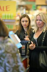 LILY COLLINS Out Shopping in Los Angeles 07/09/2019