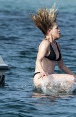 MELANIE GRIFFITH in Black Bikini on Vacaton in Ibiza 07/04/2019