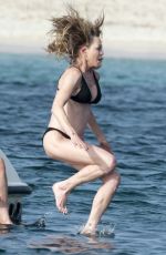 MELANIE GRIFFITH in Black Bikini on Vacaton in Ibiza 07/04/2019