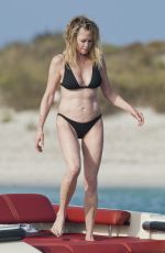MELANIE GRIFFITH in Black Bikini on Vacaton in Ibiza 07/04/2019