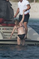 MELANIE GRIFFITH in Black Bikini on Vacaton in Ibiza 07/04/2019