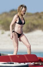 MELANIE GRIFFITH in Black Bikini on Vacaton in Ibiza 07/04/2019