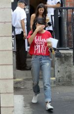 MILA KUNIS Leaves Joan