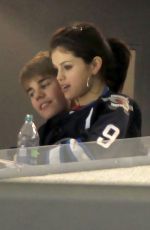 SELENA GOMEZ and Justin Bieber at a Hockey Game in Winnipeg 10/22/2011