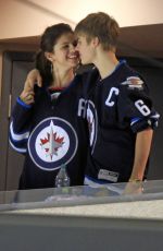 SELENA GOMEZ and Justin Bieber at a Hockey Game in Winnipeg 10/22/2011