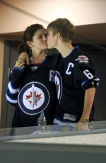 SELENA GOMEZ and Justin Bieber at a Hockey Game in Winnipeg 10/22/2011