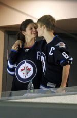 SELENA GOMEZ and Justin Bieber at a Hockey Game in Winnipeg 10/22/2011