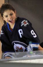 SELENA GOMEZ and Justin Bieber at a Hockey Game in Winnipeg 10/22/2011