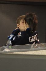 SELENA GOMEZ and Justin Bieber at a Hockey Game in Winnipeg 10/22/2011