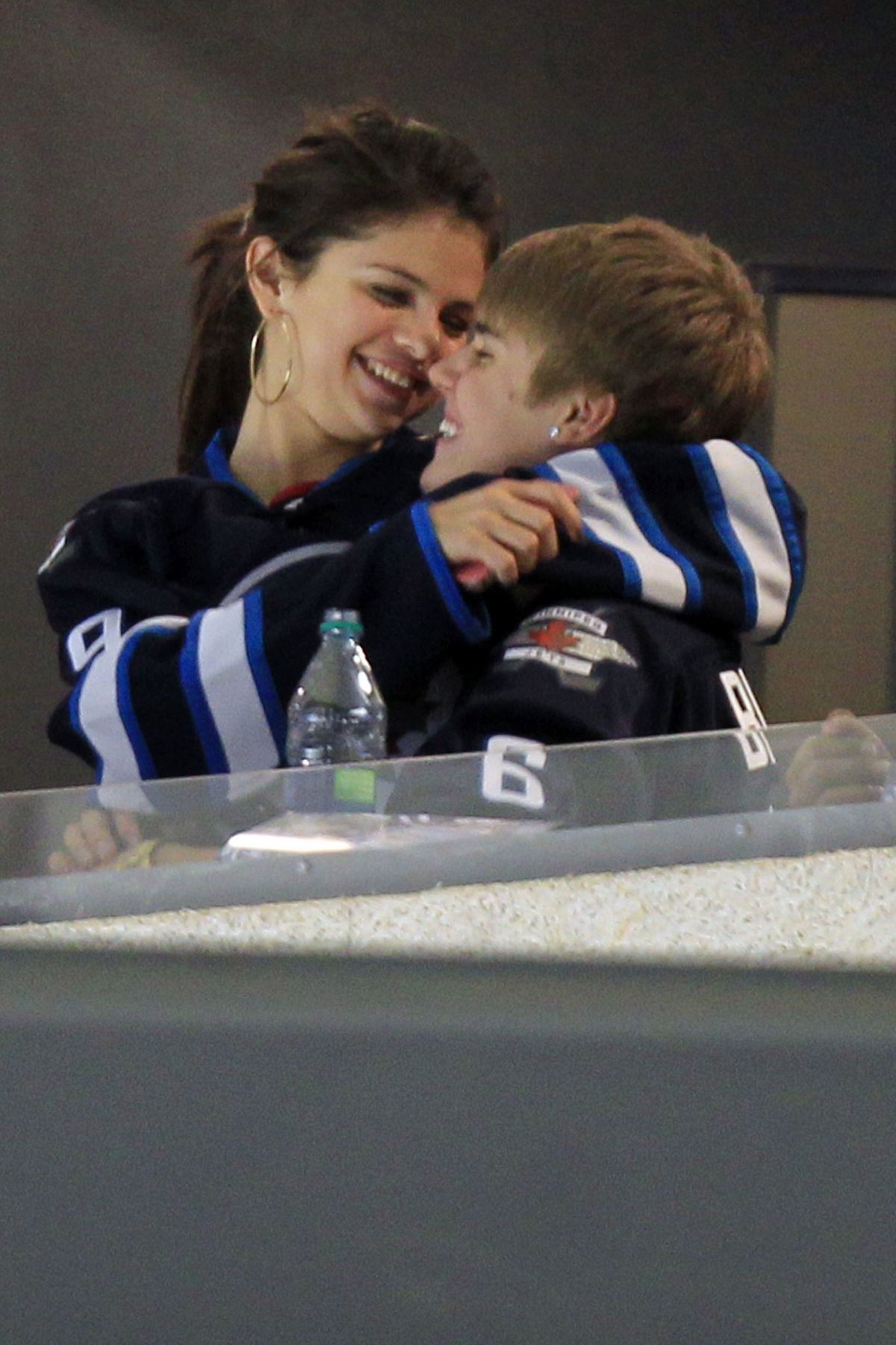 SELENA GOMEZ and Justin Bieber at a Hockey Game in Winnipeg 10/22/2011