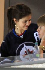 SELENA GOMEZ and Justin Bieber at a Hockey Game in Winnipeg 10/22/2011