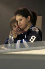 SELENA GOMEZ and Justin Bieber at a Hockey Game in Winnipeg 10/22/2011