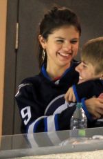 SELENA GOMEZ and Justin Bieber at a Hockey Game in Winnipeg 10/22/2011