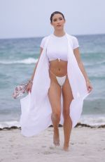 TAO WICKRATH in White Swimsuit on the Beach in Miami 07/24/2019