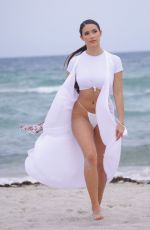 TAO WICKRATH in White Swimsuit on the Beach in Miami 07/24/2019