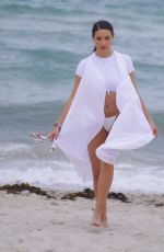 TAO WICKRATH in White Swimsuit on the Beach in Miami 07/24/2019
