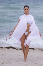 TAO WICKRATH in White Swimsuit on the Beach in Miami 07/24/2019