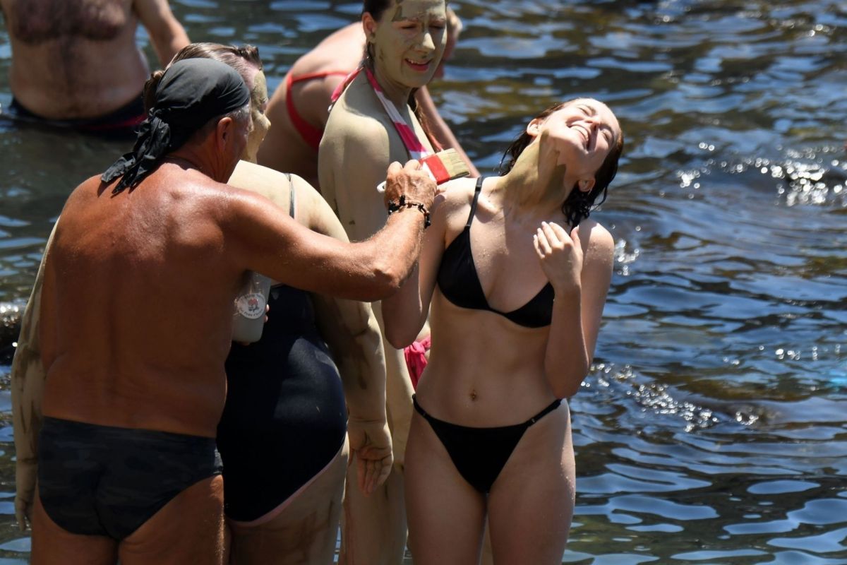 ZOEY DEUTCH in Bikini at a Beach in Ischia 07/17/2019.