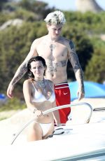BELLA THORNE in Bikini and Beanjamin Mascolo at a Boat in Sardinia 08/21/2019