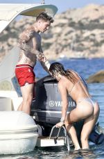 BELLA THORNE in Bikini and Beanjamin Mascolo at a Boat in Sardinia 08/21/2019
