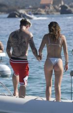 BELLA THORNE in Bikini and Beanjamin Mascolo at a Boat in Sardinia 08/21/2019