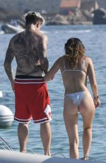 BELLA THORNE in Bikini and Beanjamin Mascolo at a Boat in Sardinia 08/21/2019