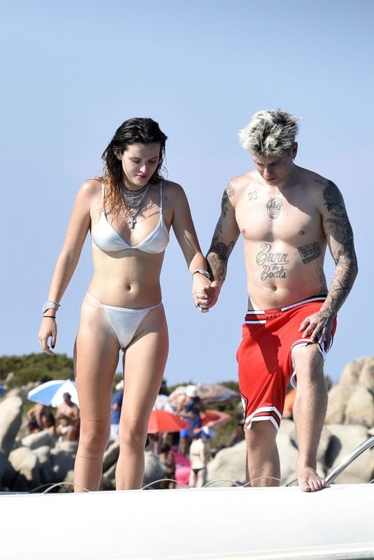 BELLA THORNE in Bikini and Beanjamin Mascolo at a Boat in Sardinia 08/21/2019