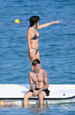 BELLA THORNE in Black Bikini on Vacation in Sardinia 08/25/2019