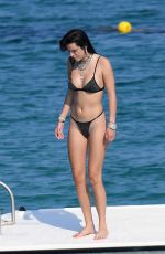 BELLA THORNE in Black Bikini on Vacation in Sardinia 08/25/2019