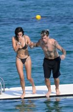 BELLA THORNE in Black Bikini on Vacation in Sardinia 08/25/2019