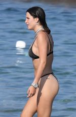 BELLA THORNE in Black Bikini on Vacation in Sardinia 08/25/2019