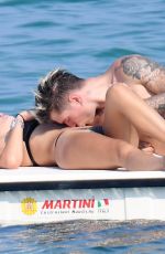BELLA THORNE in Black Bikini on Vacation in Sardinia 08/25/2019