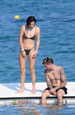 BELLA THORNE in Black Bikini on Vacation in Sardinia 08/25/2019