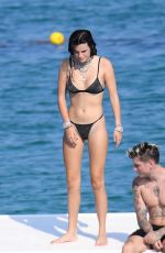 BELLA THORNE in Black Bikini on Vacation in Sardinia 08/25/2019