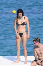 BELLA THORNE in Black Bikini on Vacation in Sardinia 08/25/2019