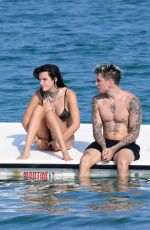 BELLA THORNE in Black Bikini on Vacation in Sardinia 08/25/2019