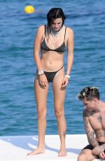 BELLA THORNE in Black Bikini on Vacation in Sardinia 08/25/2019