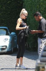 CHARLOTTE MCKINNEY Arrives at Cecconi