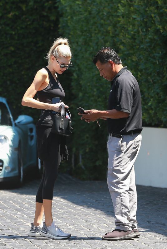 CHARLOTTE MCKINNEY Arrives at Cecconi