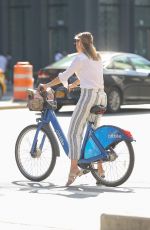 CHRISTINE EVANGELISTA Riding a City Bike in New York 08/12/2019