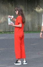 DAKOTA JOHNSON and Chris Martin Out for Lunch in The Hampton