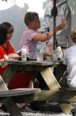 DAKOTA JOHNSON and Chris Martin Out for Lunch in The Hampton