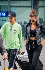 ELEANOR CALDER and Louis Tomlinson at Heathrow Airport 08/28/2019