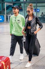 ELEANOR CALDER and Louis Tomlinson at Heathrow Airport 08/28/2019